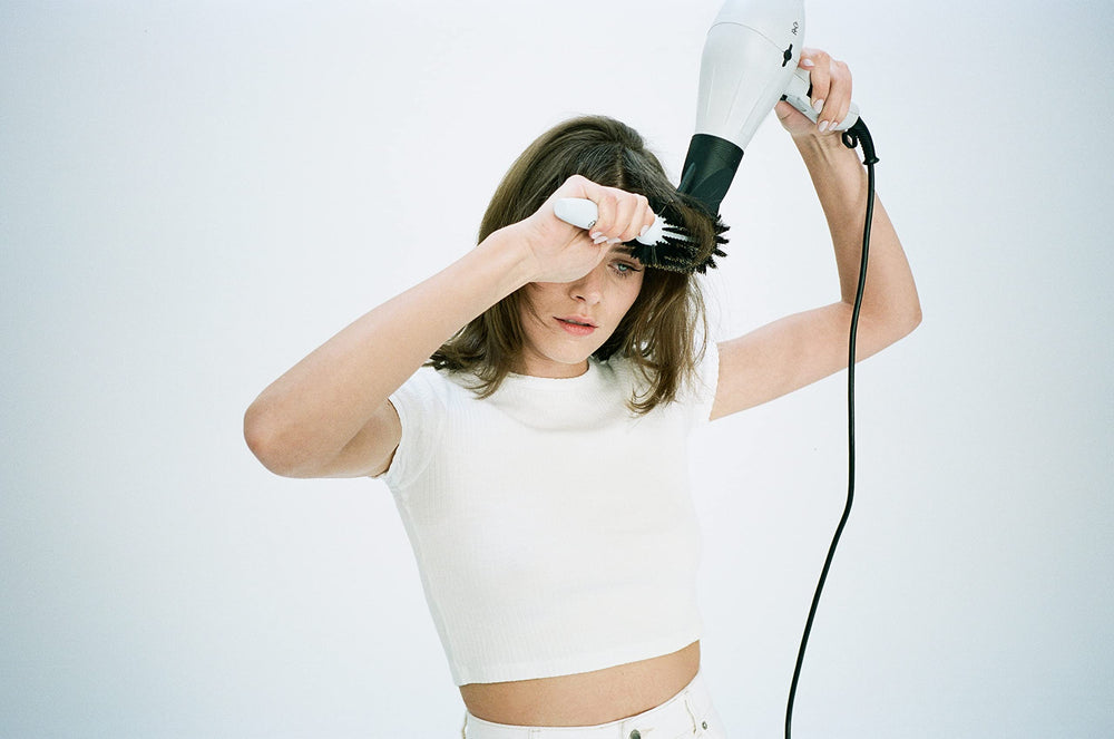 R+Co Mood Swing damp hair ready to blow-dry for heat-activated straightening.