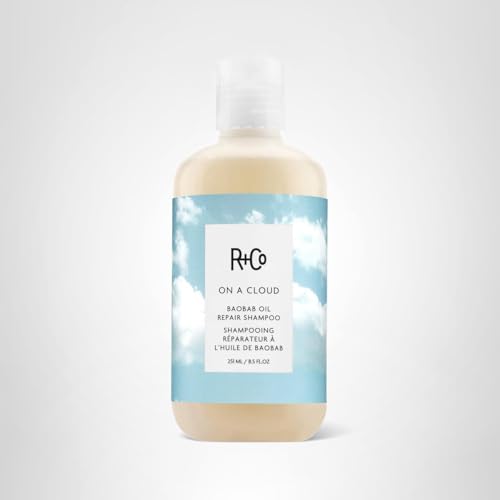 Packaging box of R+Co On A Cloud Baobab Repair Shampoo on shelf.