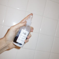 R+Co Spiritualized Dry Shampoo Mist applied to roots for quick refresh.