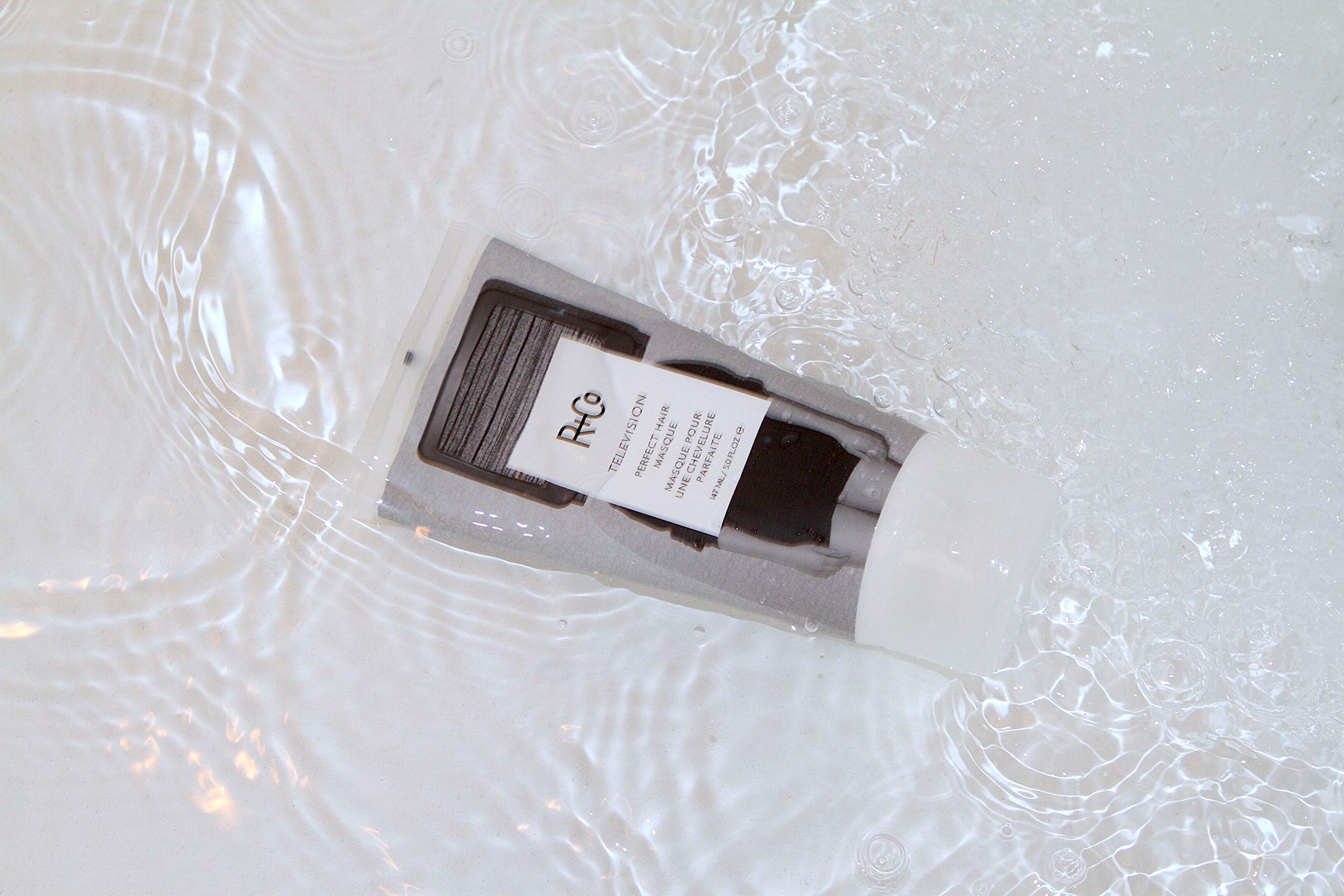 R+Co Television Masque applying to hair demonstrates easier manageability and elasticity