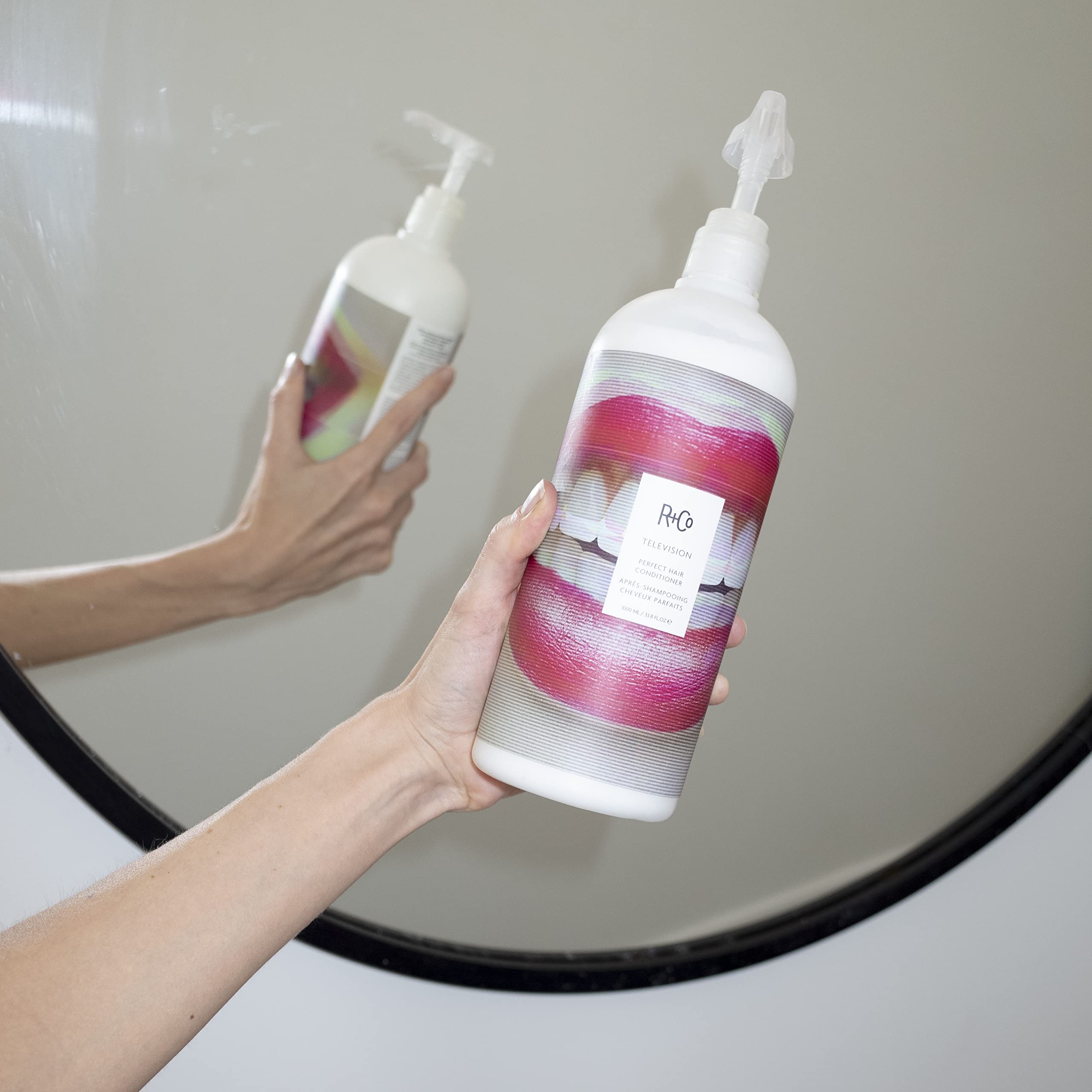 R+Co Television Perfect Hair Conditioner label-closeup highlights premium formula for smoother ends.