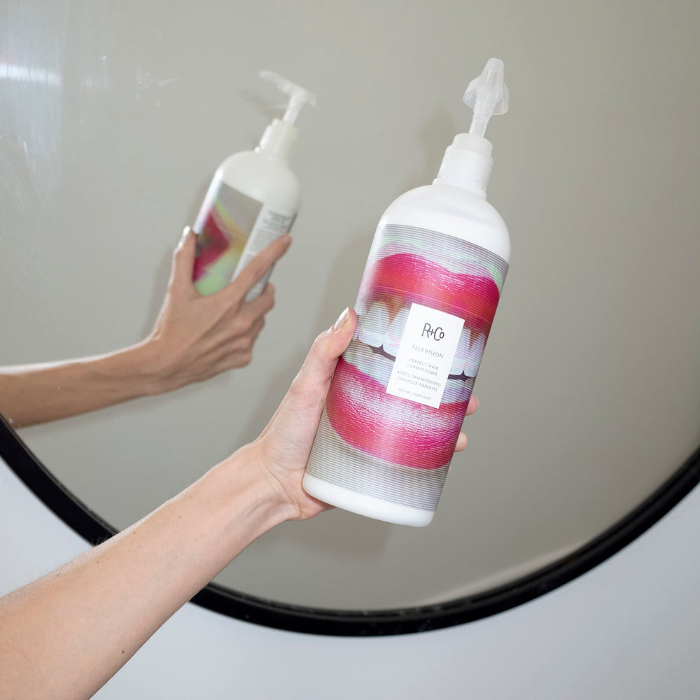 R+Co Television Perfect Hair Conditioner label-closeup highlights premium formula for smoother ends.