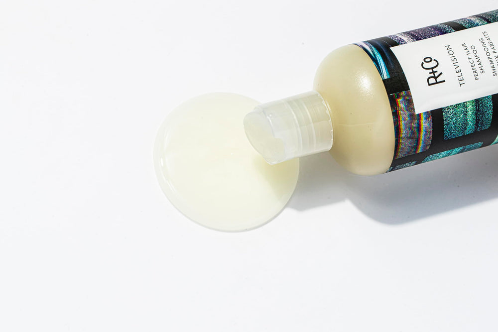 R+Co Television Perfect Hair Shampoo close-up emphasizes shine-enhancing softness.