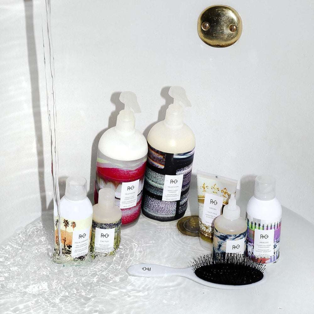 R+Co Television Perfect Hair Shampoo glossy shine shot highlighting reflective strands.