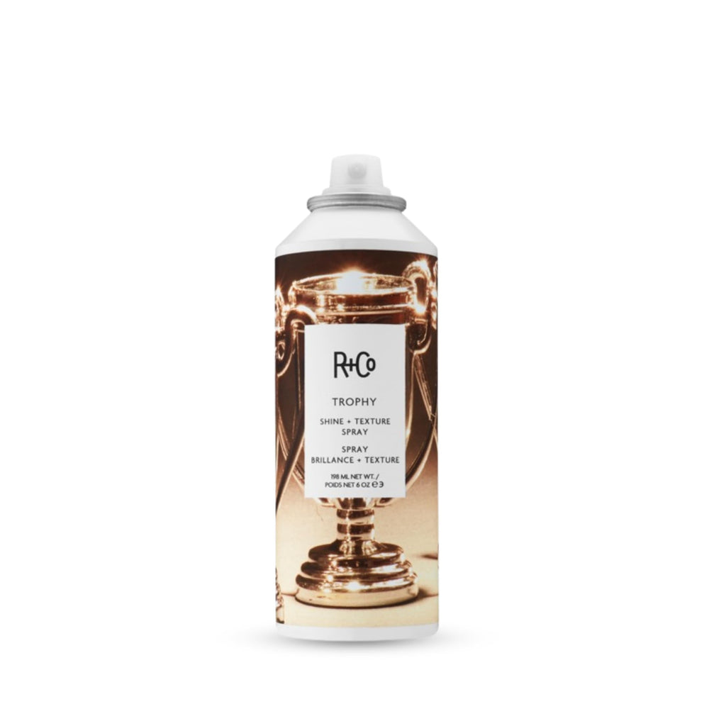 R+Co Trophy Shine + Texture Spray bottle provides texture and radiant shine for easy styling