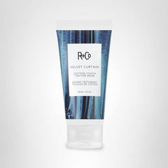 R+Co Velvet Curtain packaging on shelf signals premium texture balm.