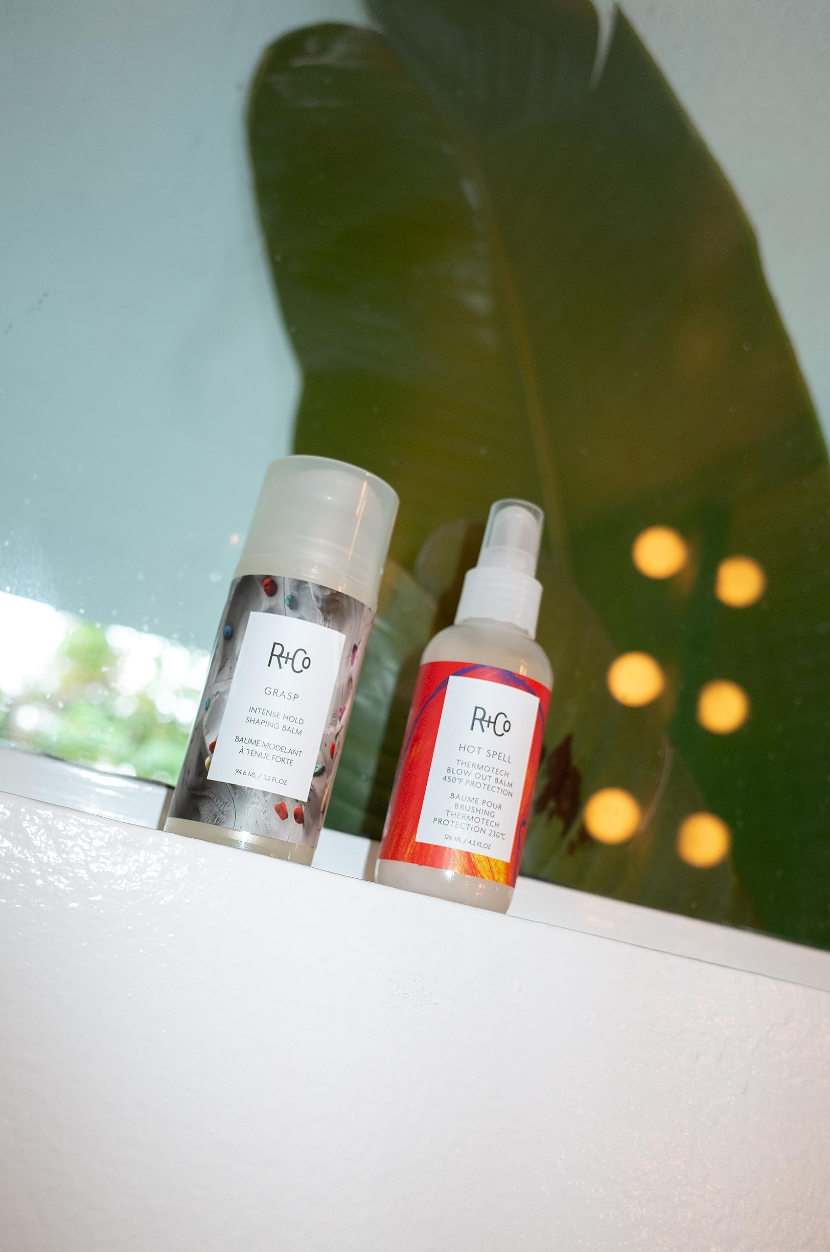 R+Co Hot Spell Thermotech Balm ingredient kiwi-oil closeup for hydration and shine.