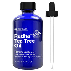 Radha Beauty Tea Tree Oil bottle in cobalt blue, ideal for room refreshment and skin care.