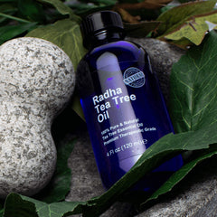 Radha Beauty Tea Tree Oil beside a diffuser setup for aromatherapy and air cleansing.
