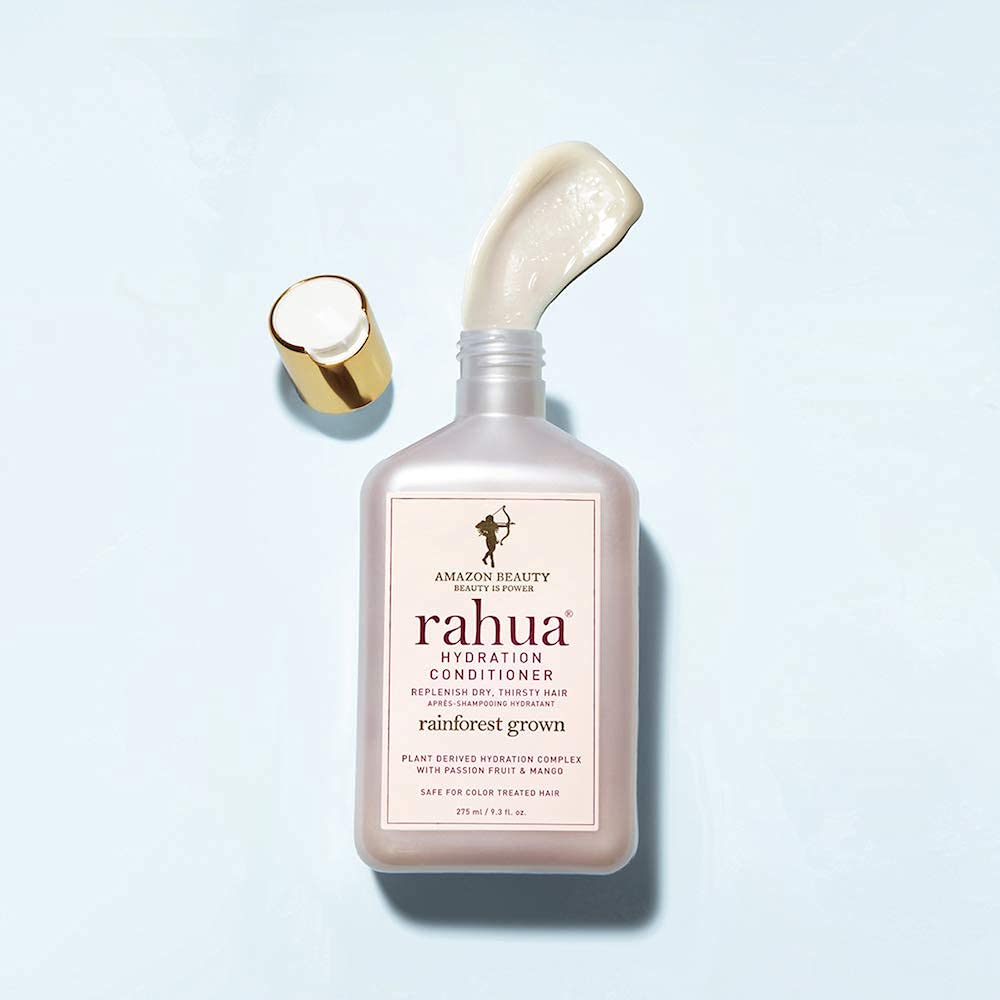 Tropical mango and passion fruit scent notes on Rahua label enrich routine.