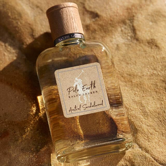 Polo Earth bottle on wood surface exudes rugged elegance for outdoor events.