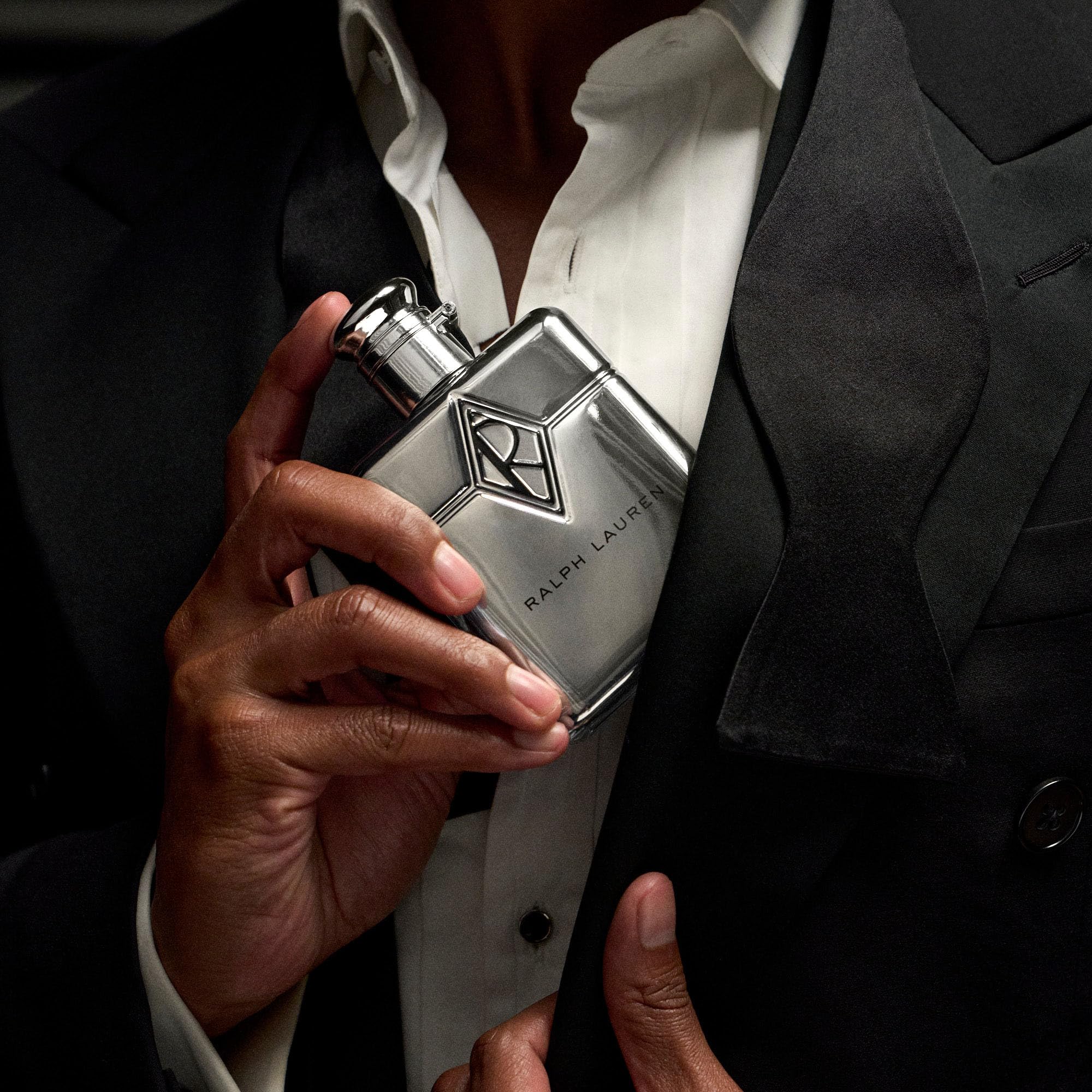 Ralph's Club New York spray applied to pulse points for lasting scent.