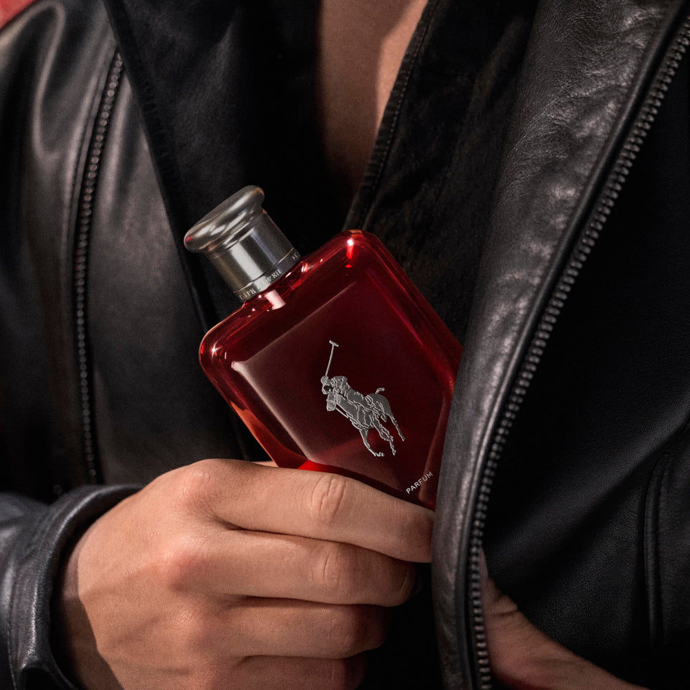 Absinthe-orris-cedarwood close-up hints at Polo Red Parfum's sensual amber-woody notes.
