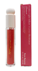 Rare Beauty Glimmer lip gloss bottle showing pearlescent rose-gold shine for hydrated lips.