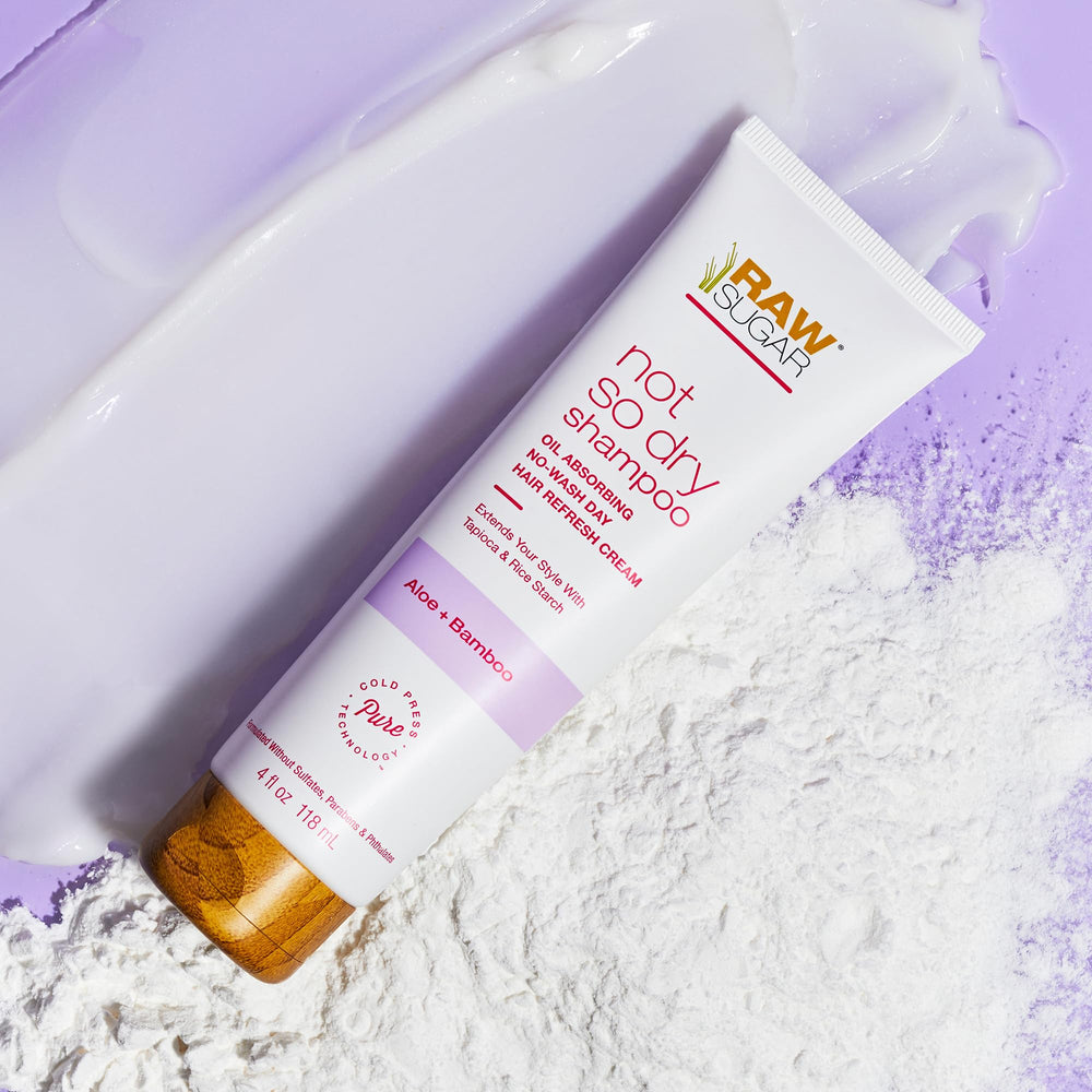 RAW SUGAR Not So Dry Shampoo tube demonstrates oil absorption for between-wash refresh.