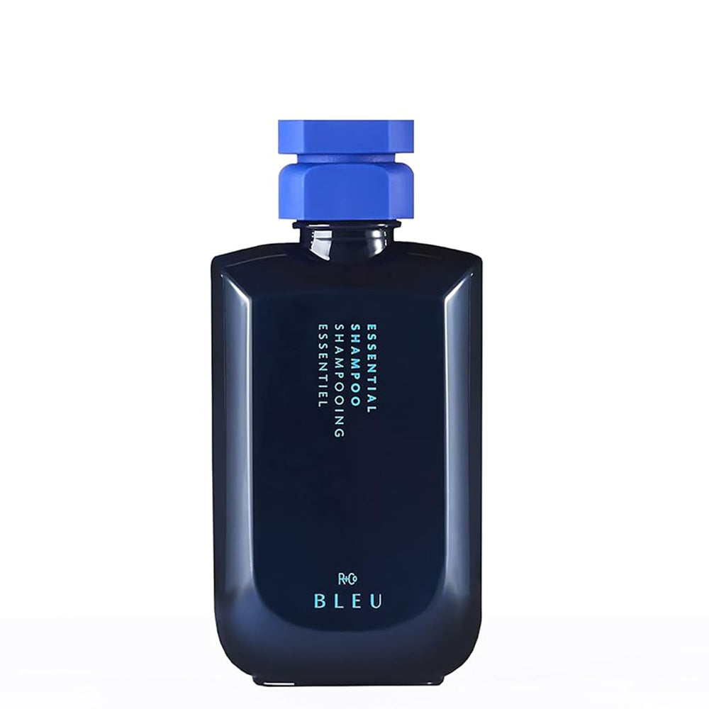 R+Co BLEU Essential Shampoo bottle closeup highlighting gentle cleansing and hydration.