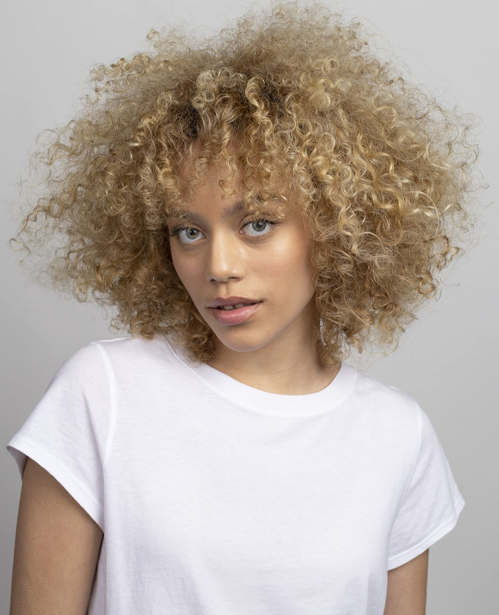 R+Co hair smoothing frizz finish shows silky, controlled texture.