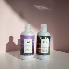 R+Co Sunset Blvd Conditioner creamy lather in hand, readying for smooth, nourished strands.