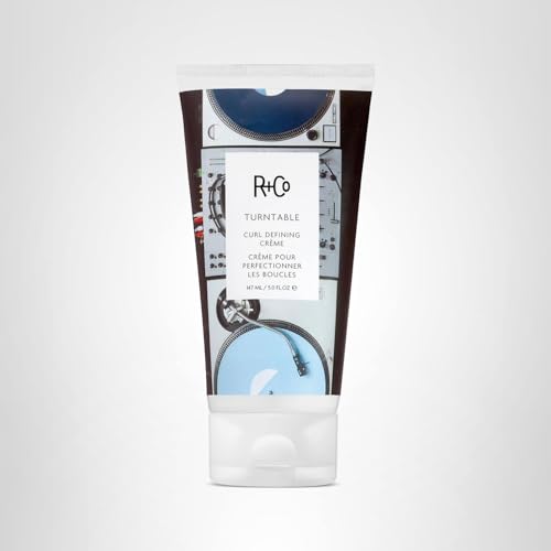 R+Co Turntable texture and shine shot on finished curls, suggesting softness and natural gloss.