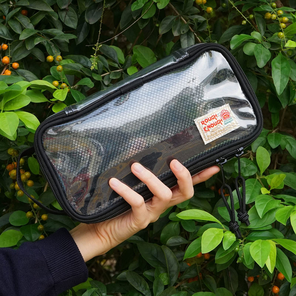 RE ROUGH ENOUGH gift-ready clear bag suits travelers and students as a practical organizer.