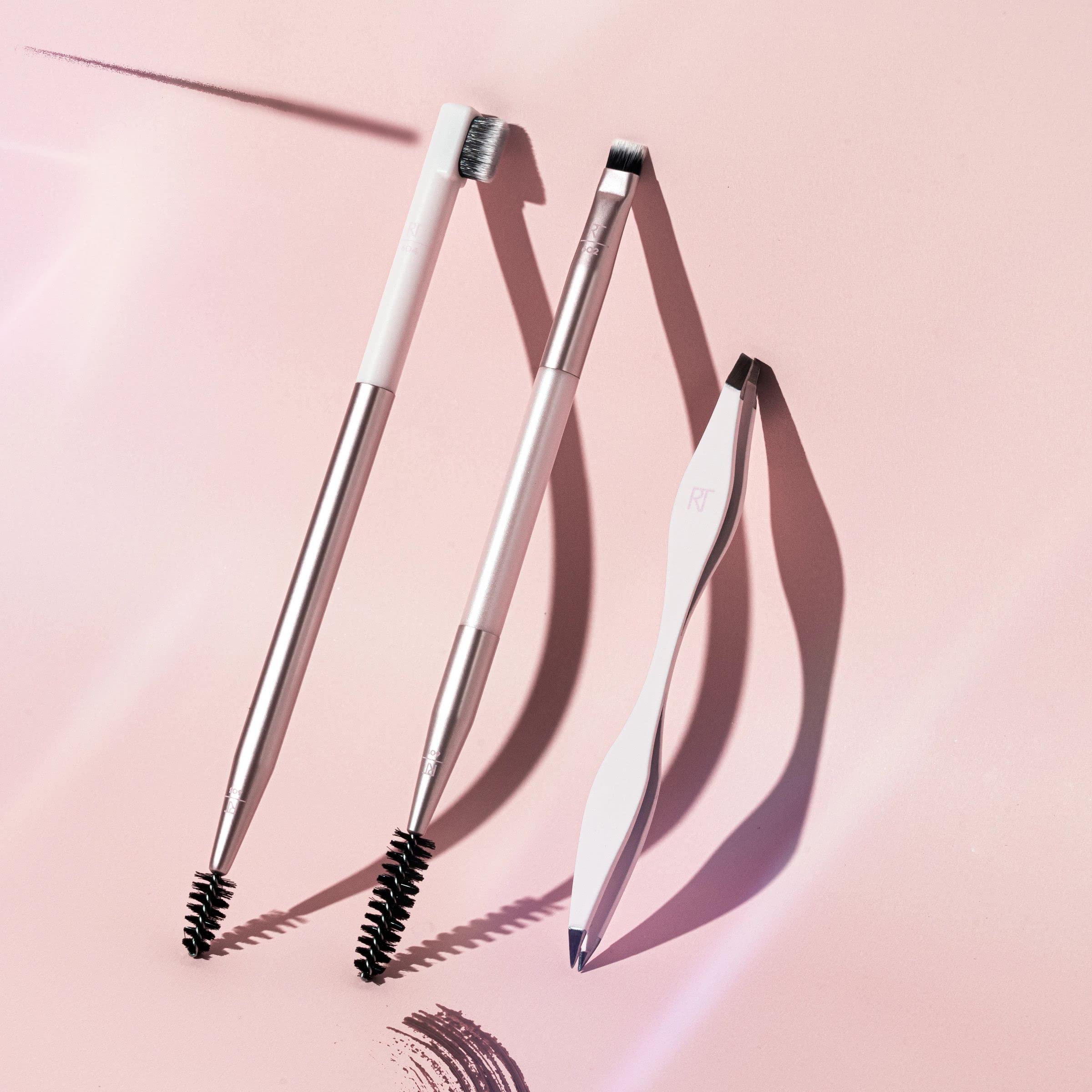Real Techniques Brow Shaping Set travel-friendly kit in hand for on-the-go grooming.
