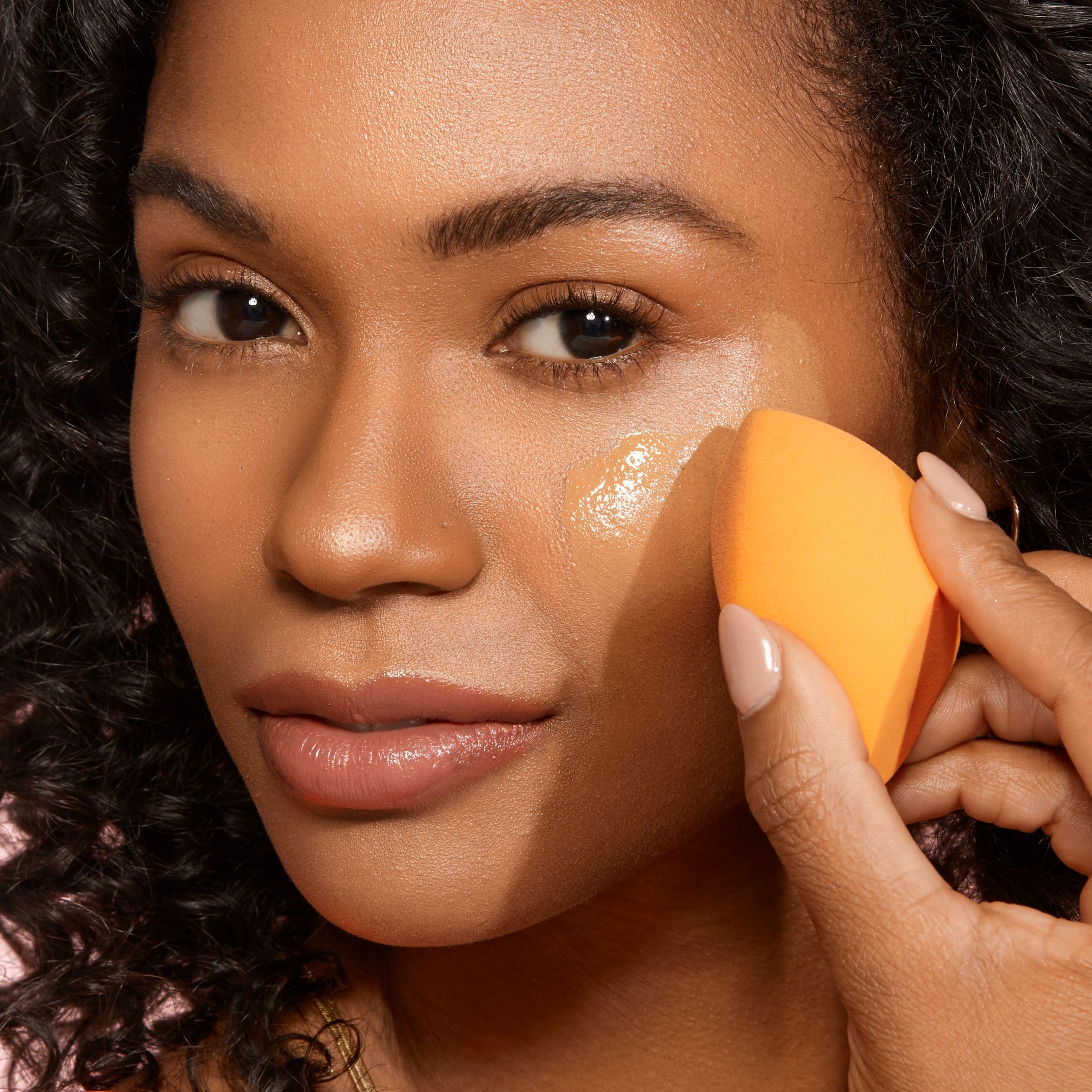 Real Techniques sponge shown with cleansing gel for easy cleaning routine.