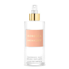 Rebecca Minkoff Blush top notes bottle close-up for vibrant daytime wear.