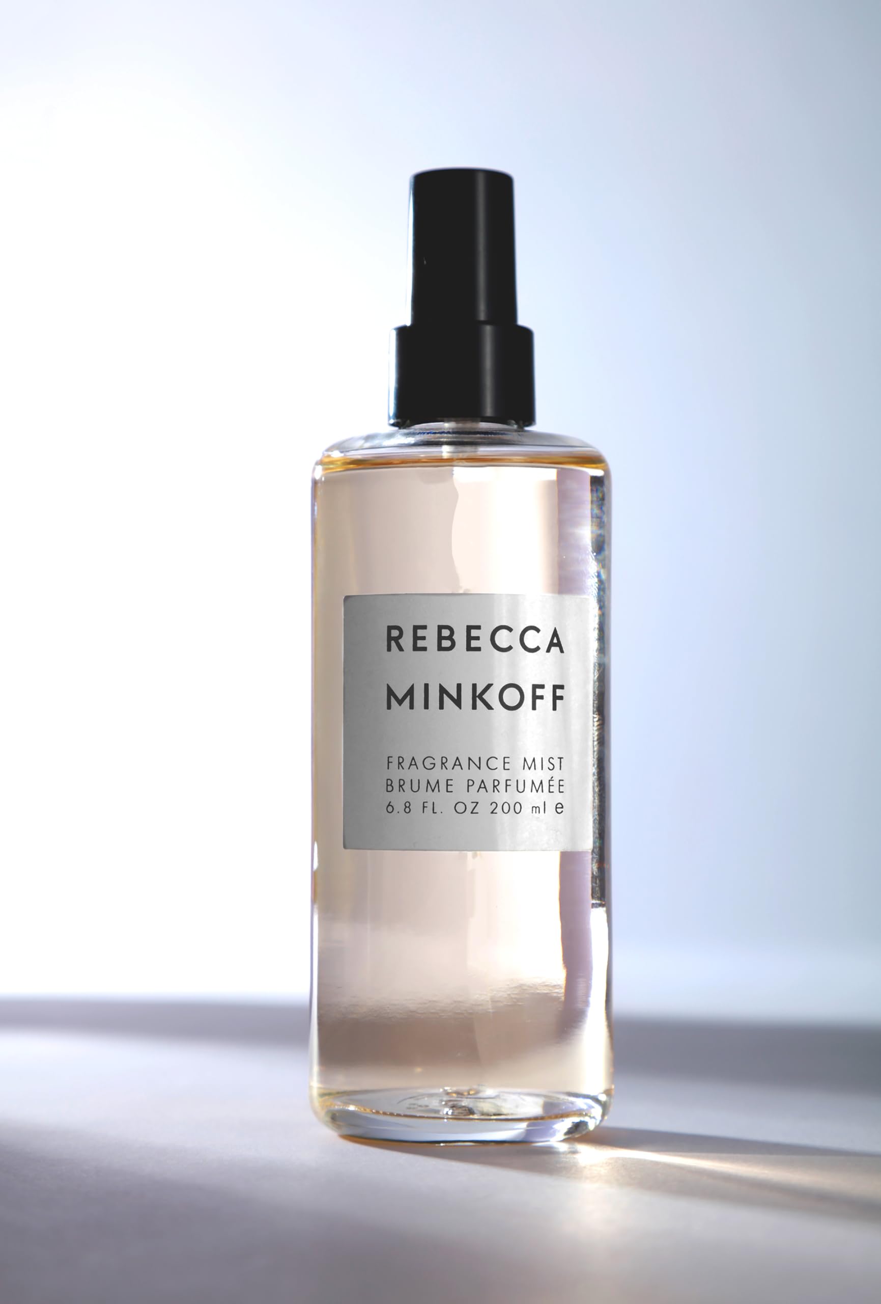 Rebecca Minkoff Body Spray bottle showcases bergamot opening for vibrant morning energy.