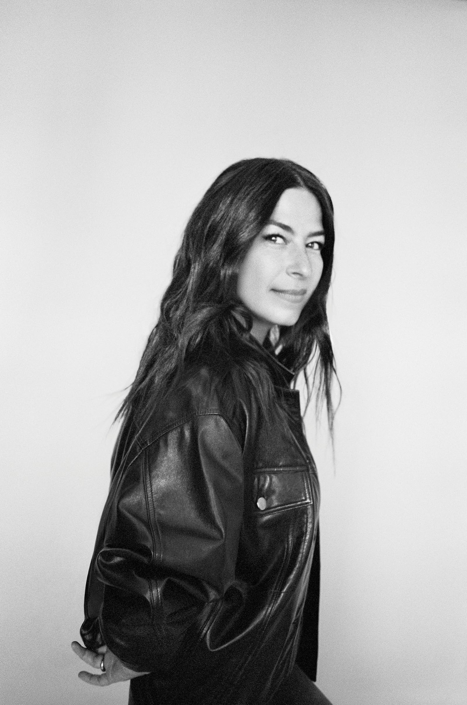 Rebecca Minkoff Body Spray application image suggests long-lasting aroma through the day.
