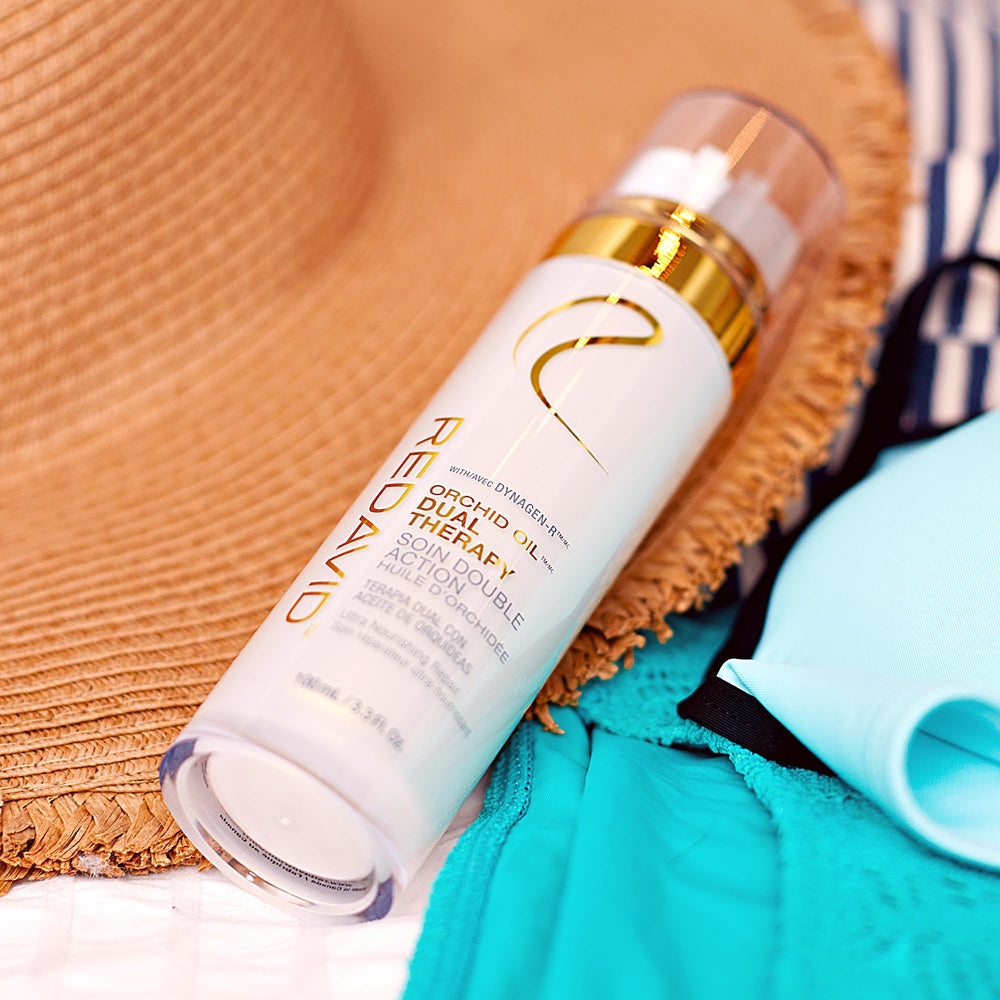 Redavid Orchid Oil Shine bottle seals cuticles for radiant, frizz-free hair.