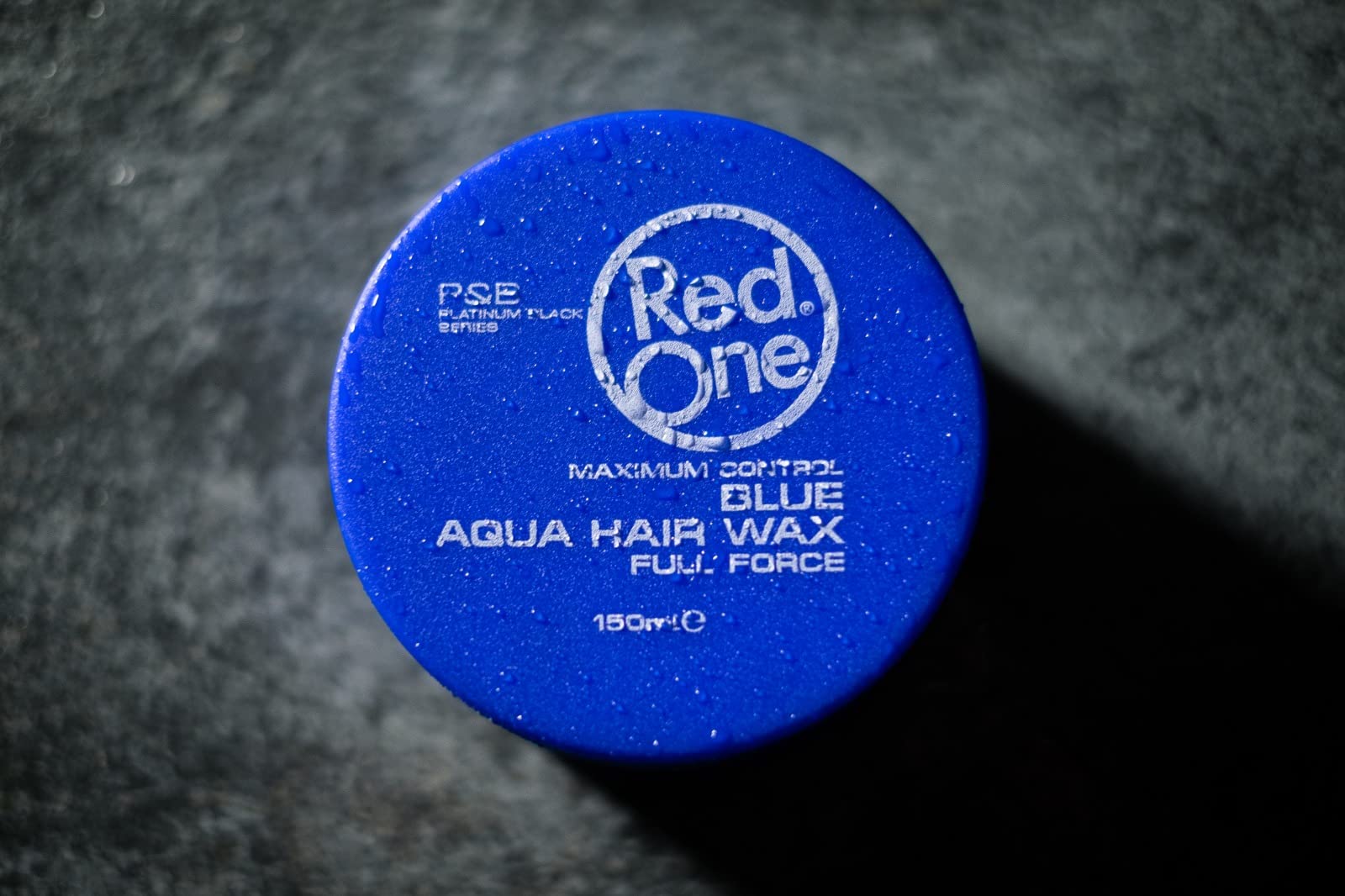 Redone Blue Wax at barber station for edge control and finish