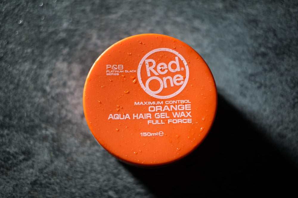 Redone Hair Wax Orange jar demonstrates easy application for precise shaping.