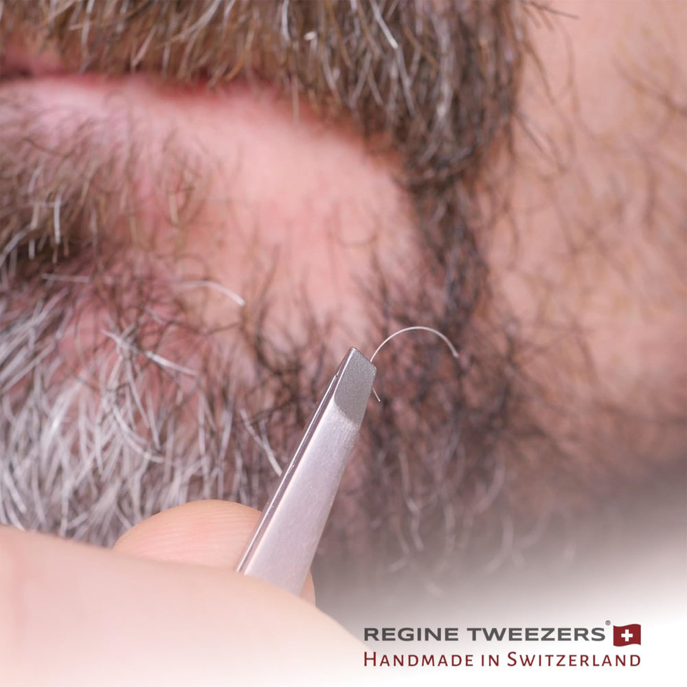 Regine Switzerland compact 3.75-inch tweezers shown for convenient travel grooming.