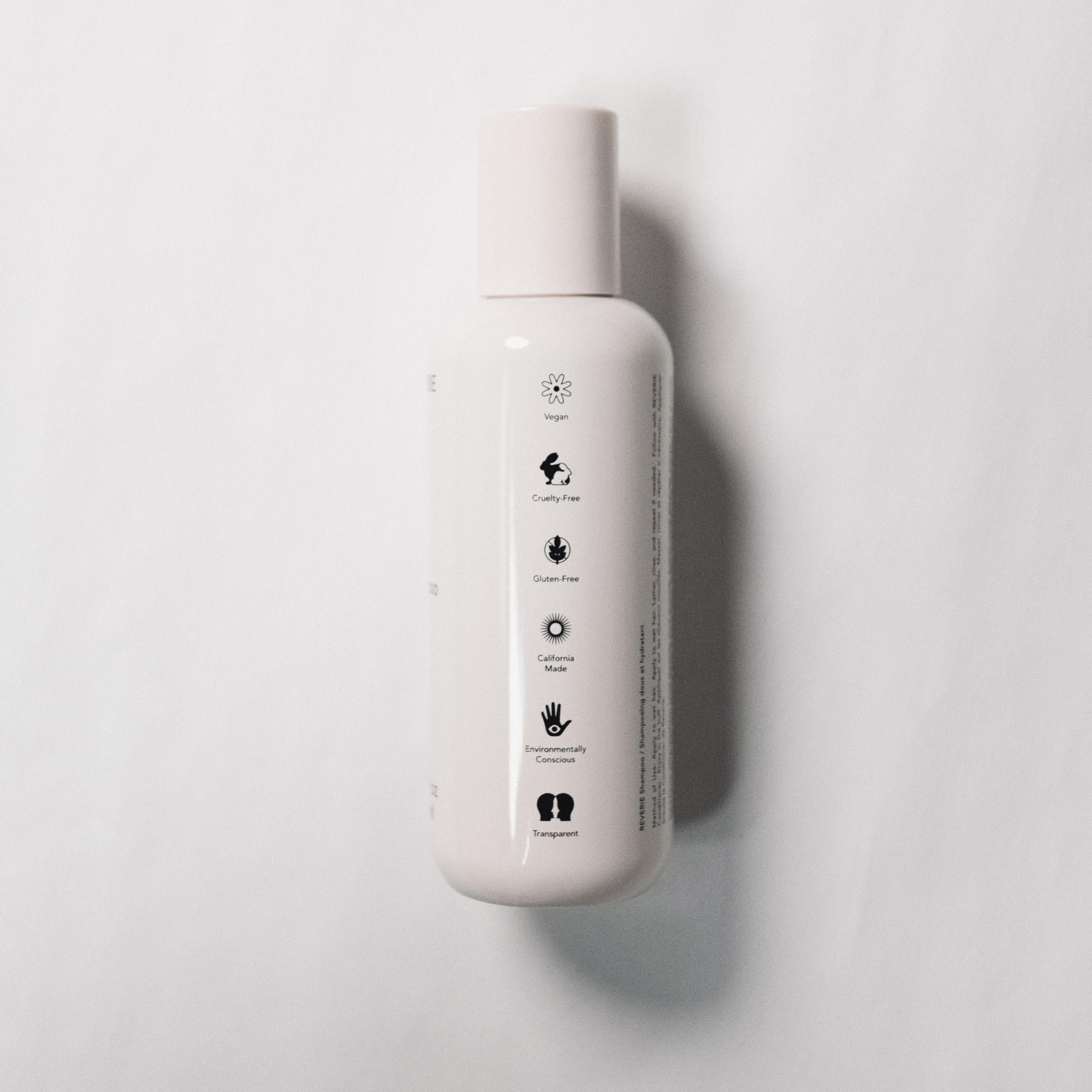 REVERIE Natural Balancing Shampoo lather on hand for gentle cleansing and hydration.