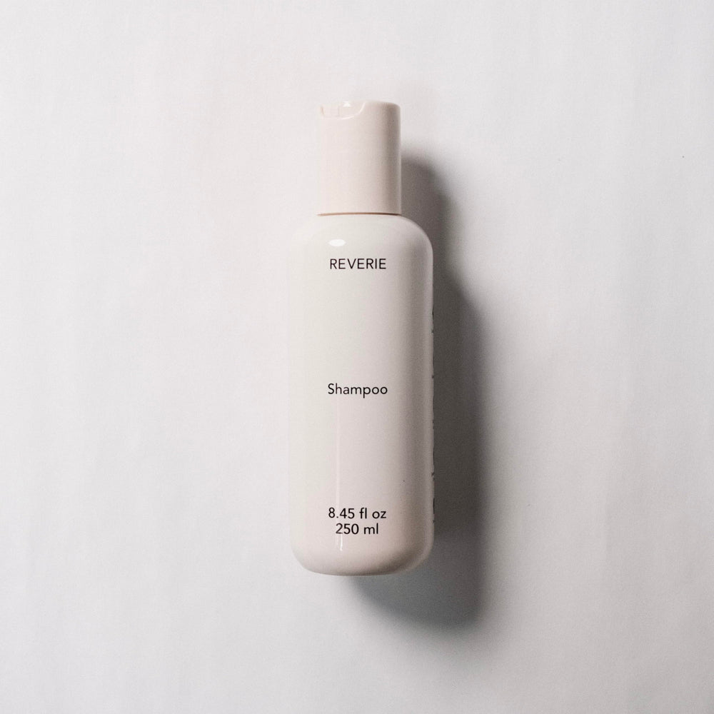 REVERIE Natural Balancing Shampoo pump-dispense top view for easy, controlled application.