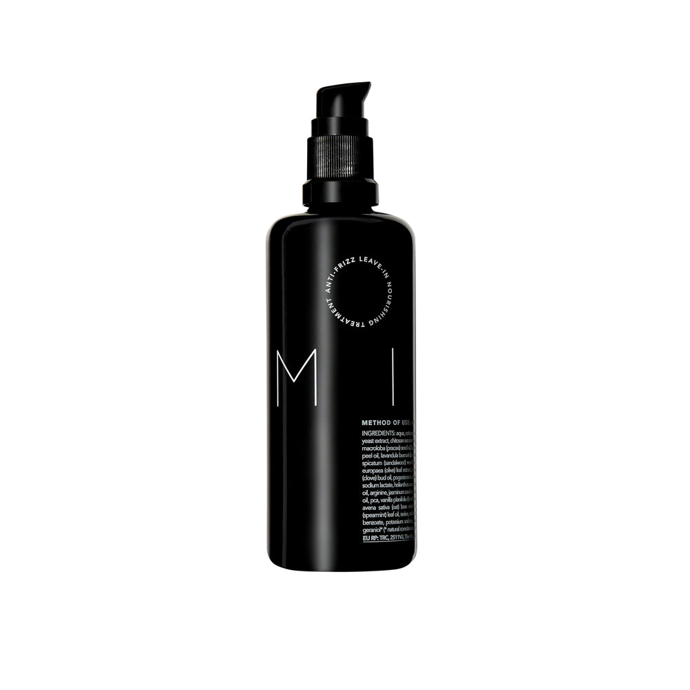 REVERIE Natural Milk Leave-In bottle pour for frizz control and lightweight hydration.
