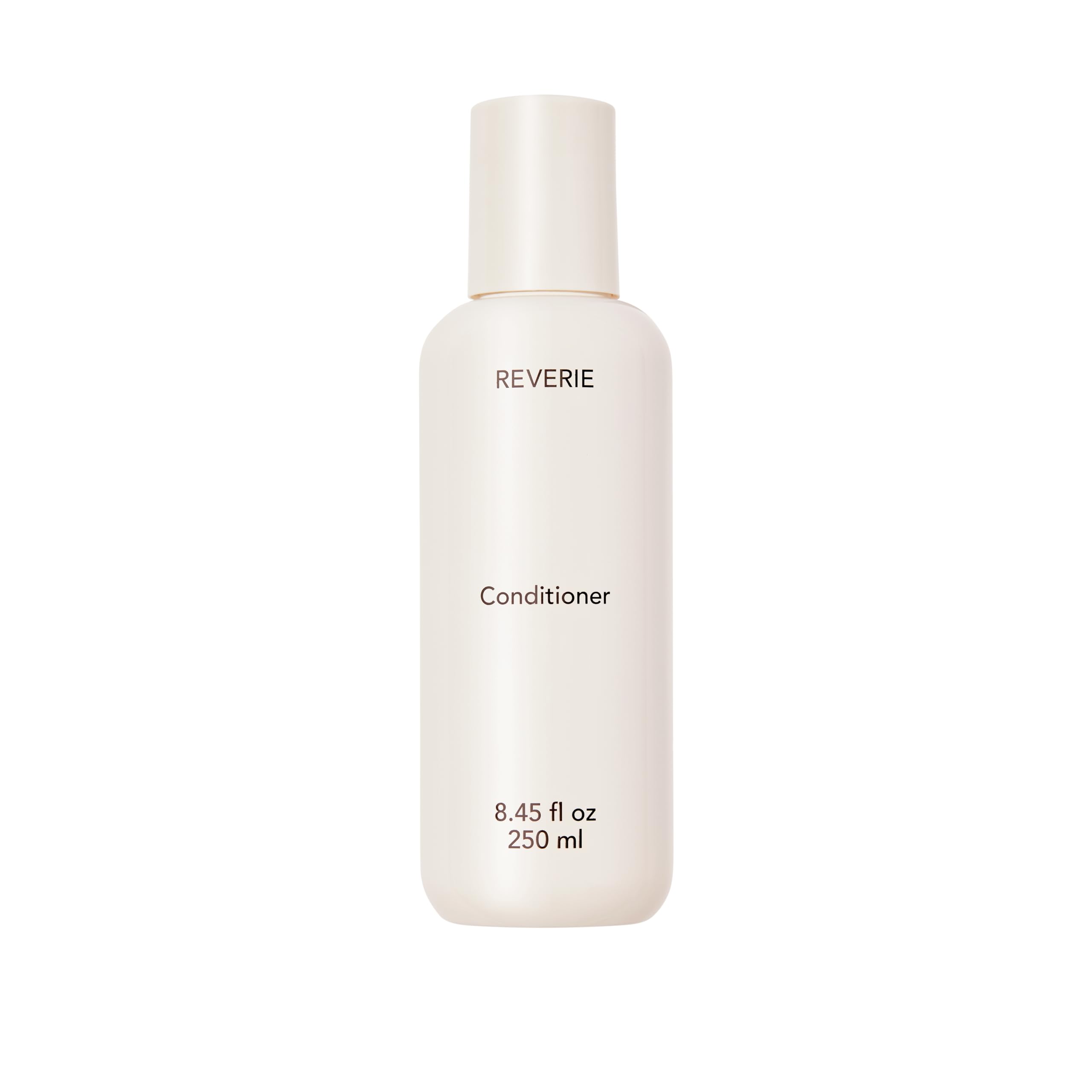 REVERIE natural nourishing conditioner bottle shows color-safe hydration for glossy, manageable hair.
