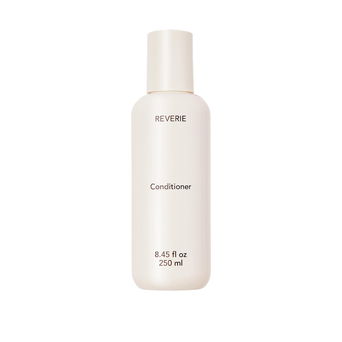REVERIE natural nourishing conditioner bottle shows color-safe hydration for glossy, manageable hair.
