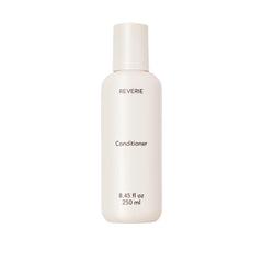 REVERIE natural nourishing conditioner bottle shows color-safe hydration for glossy, manageable hair.