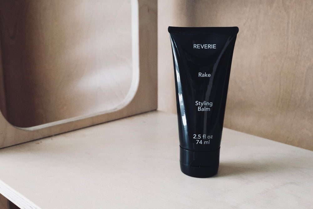 Full-size 2.5 oz REVERIE bottle on display for daily styling