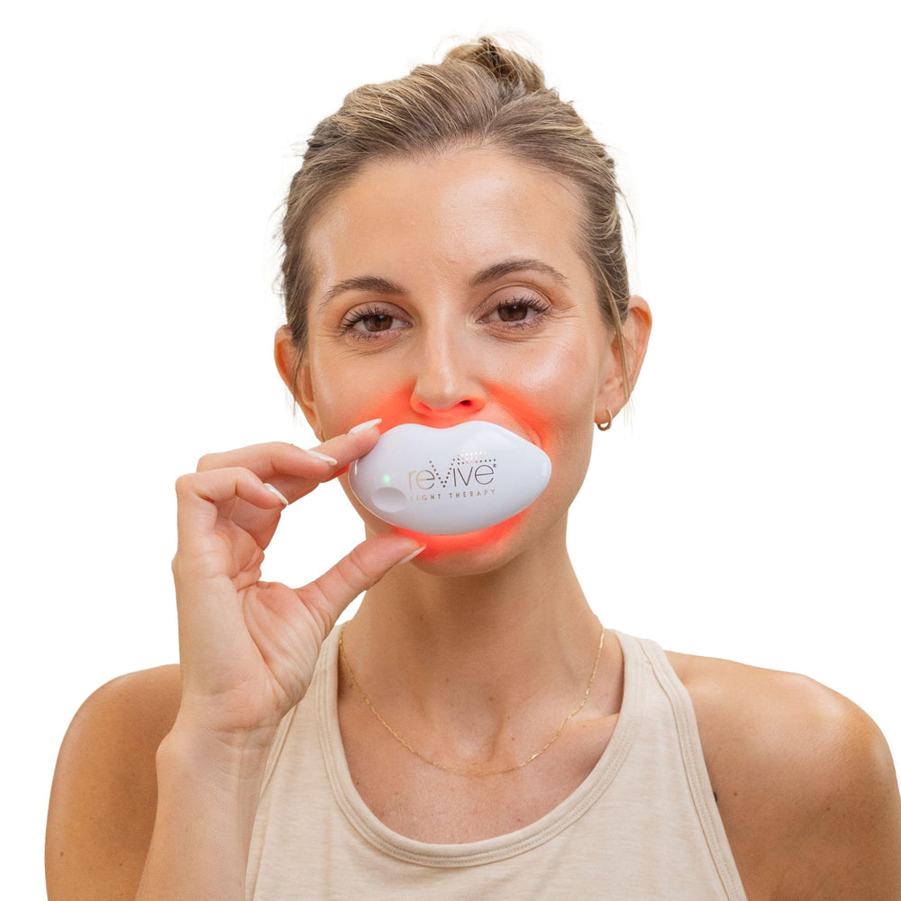 reVive Lux In-use spa-like session highlighting calming light for lips.
