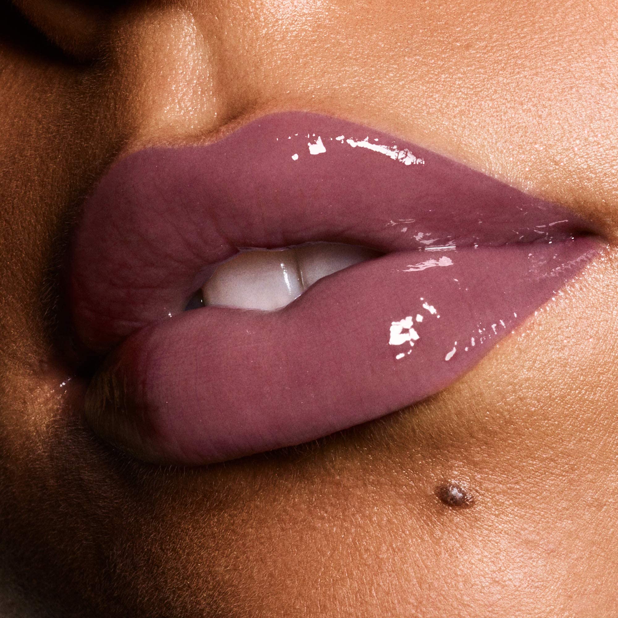 Revlon Ultra HD Vinyl Lip Polish on lips demonstrates plump appearance with lacquer shine