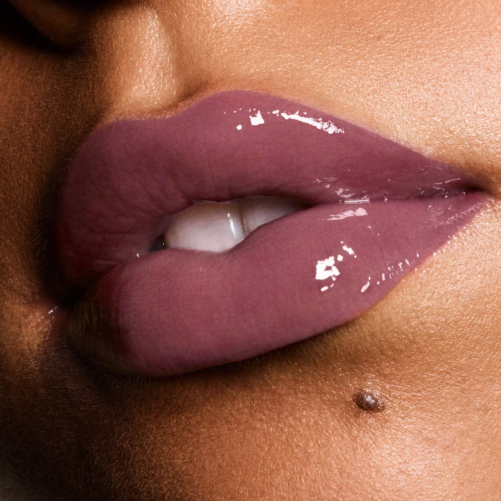 Revlon Ultra HD Vinyl Lip Polish on lips demonstrates plump appearance with lacquer shine