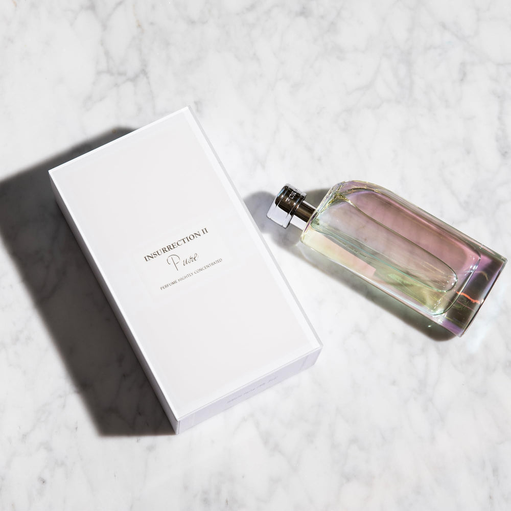 Reyane Tradition Insurrection Pure flatlay-shot highlights packaging and product elegance.