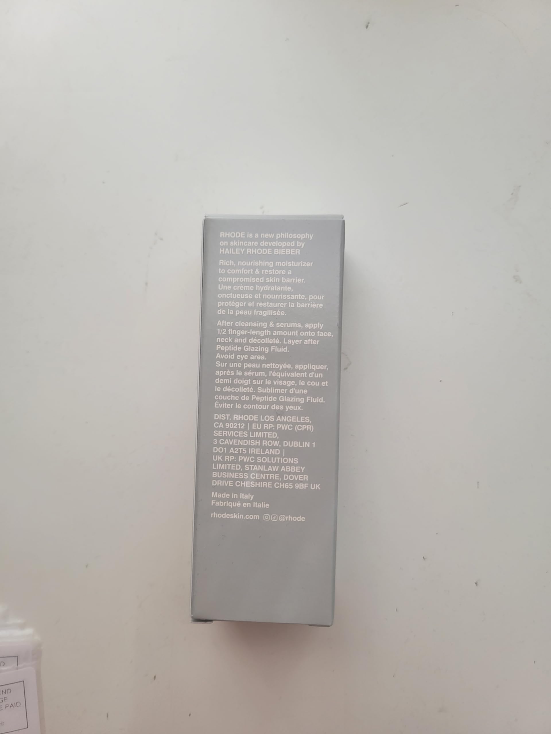 Rhode Barrier Restore Cream application on neck highlights targeted moisture.