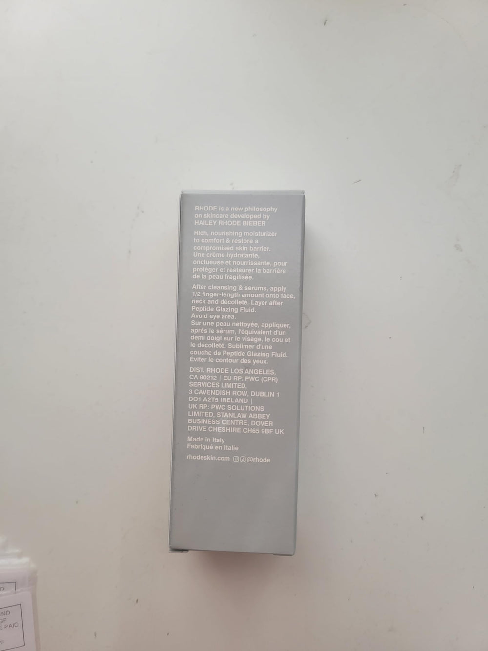 Rhode Barrier Restore Cream application on neck highlights targeted moisture.