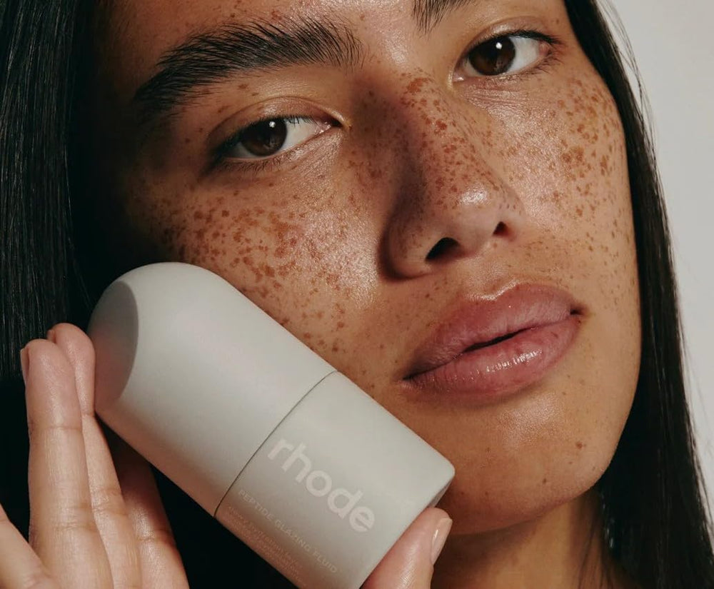 Rhode Hailey Bieber peptide glazing fluid packshot highlights minimal white packaging