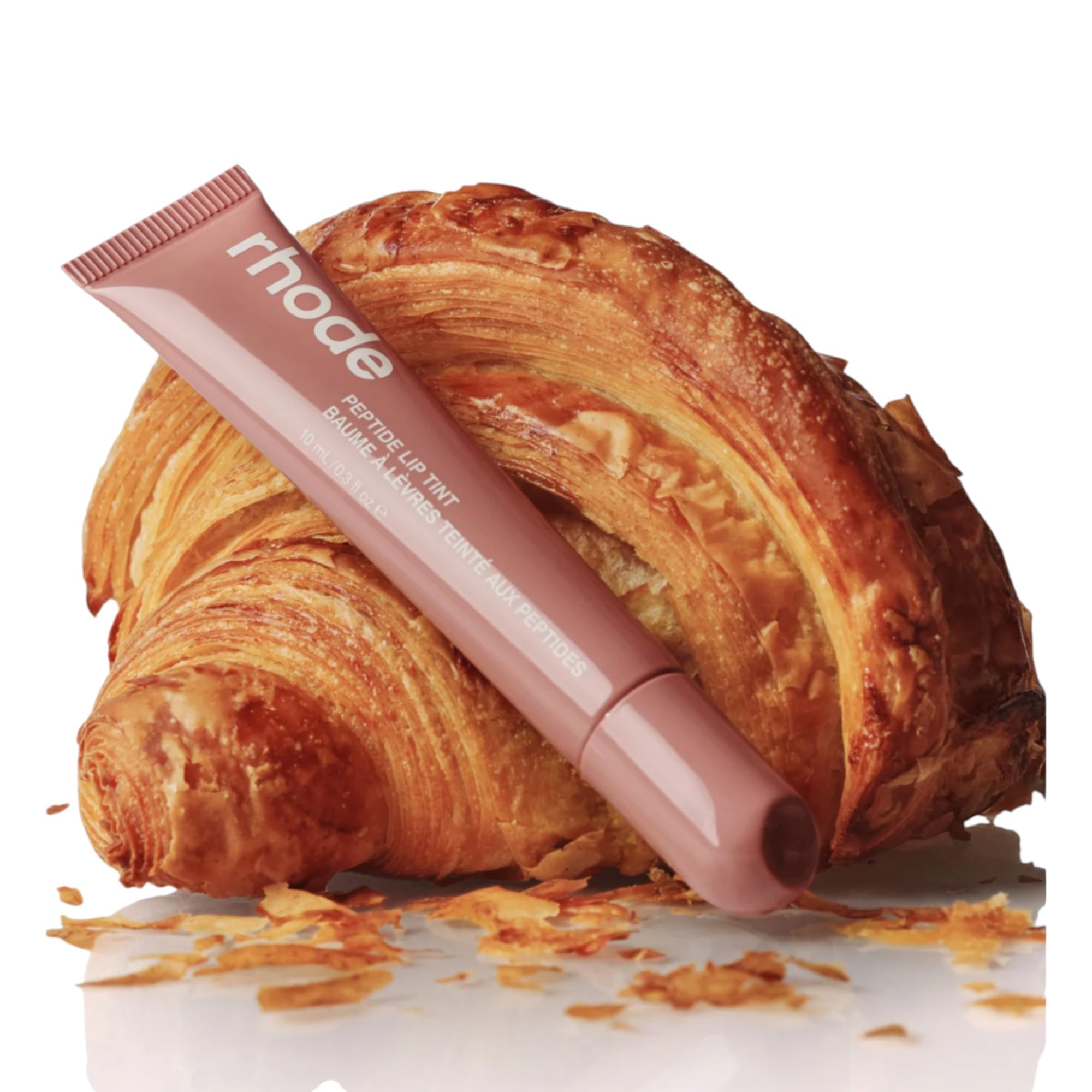 Rhode Lip Tint Toast, acabado brillante para look jugoso.