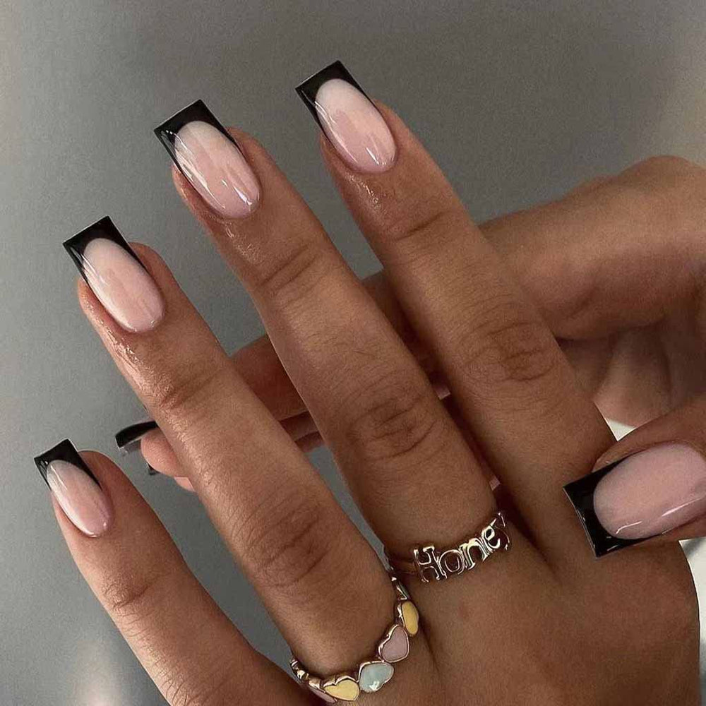 RikView French Tip press-on nails on hand for quick salon-like manicure at home