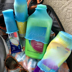 Rinseroo LeakLocks Skins nestled in a suitcase keeps toiletries neatly organized.